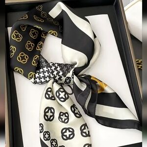 Elegant Black and Gold Patterned Scarf